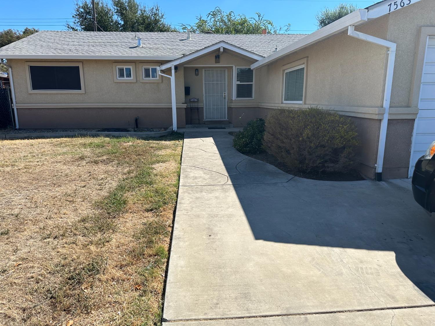 a front view of a house with yard