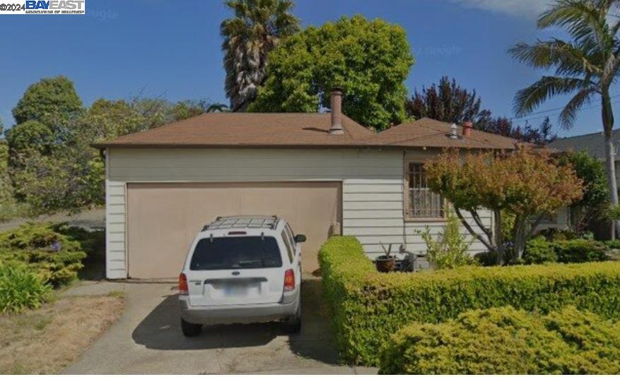 a car parked in front of a house