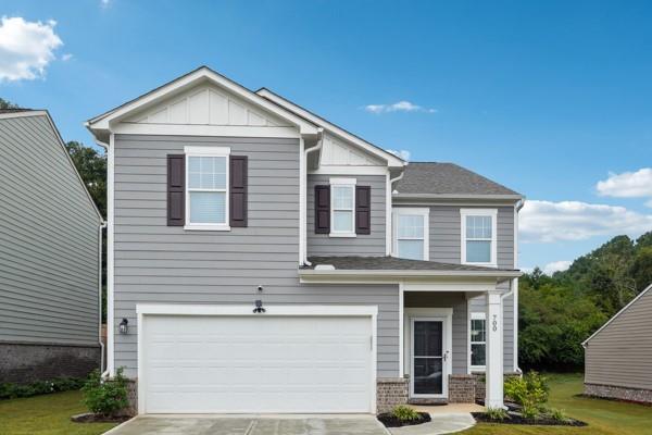 a front view of a house with garage