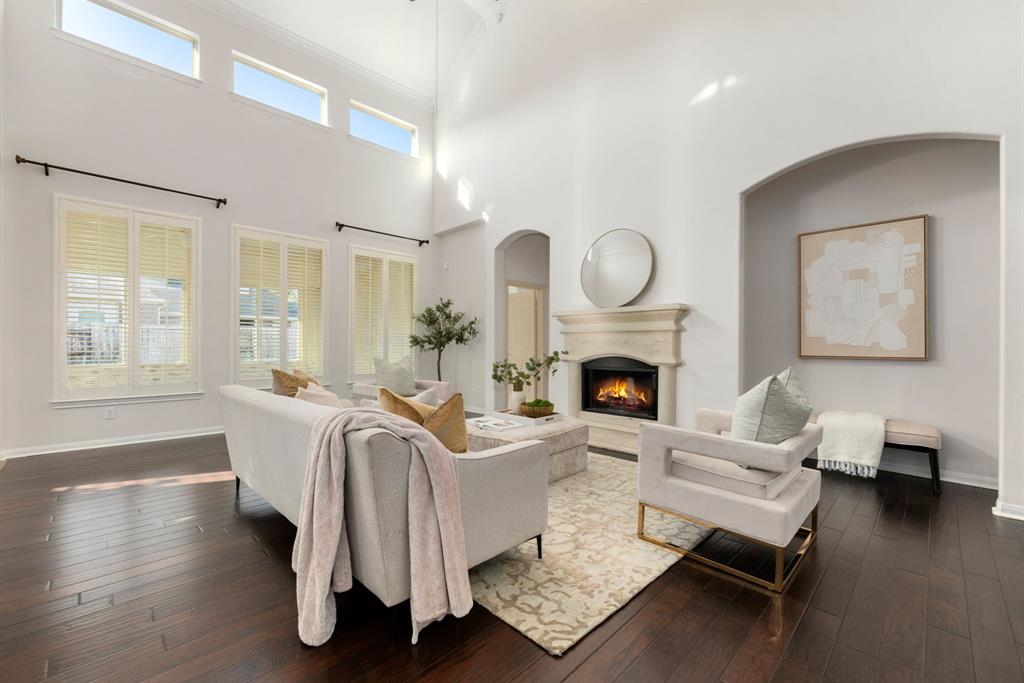 Soaring 20-foot ceilings fill the space with abundant natural light, creating an airy and open atmosphere.