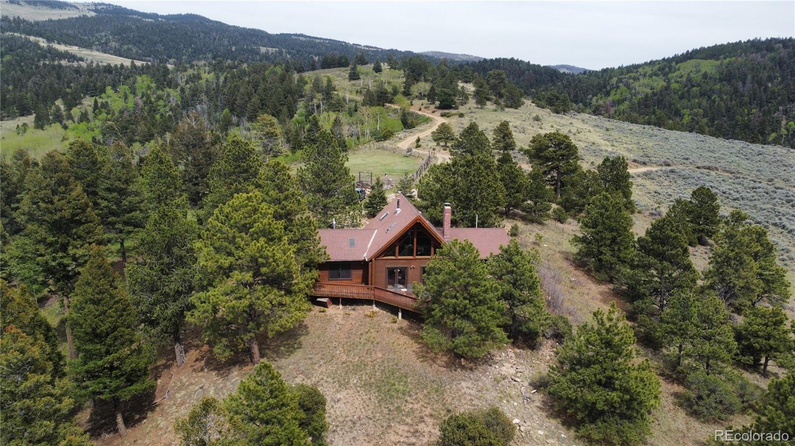 an aerial view of a house with mountain view