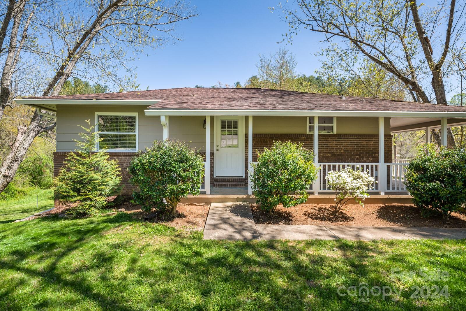 front view of a house with a yard