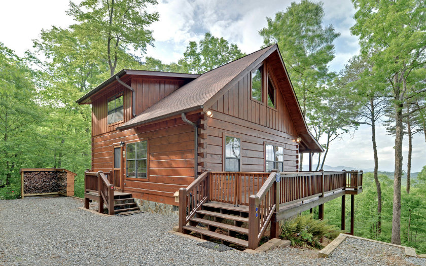 a view of backyard with deck and garden