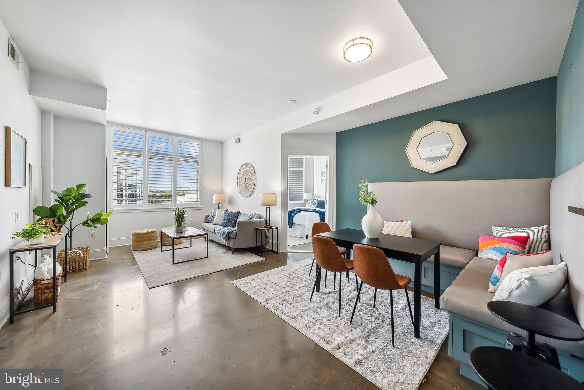 a living room with furniture and a clock