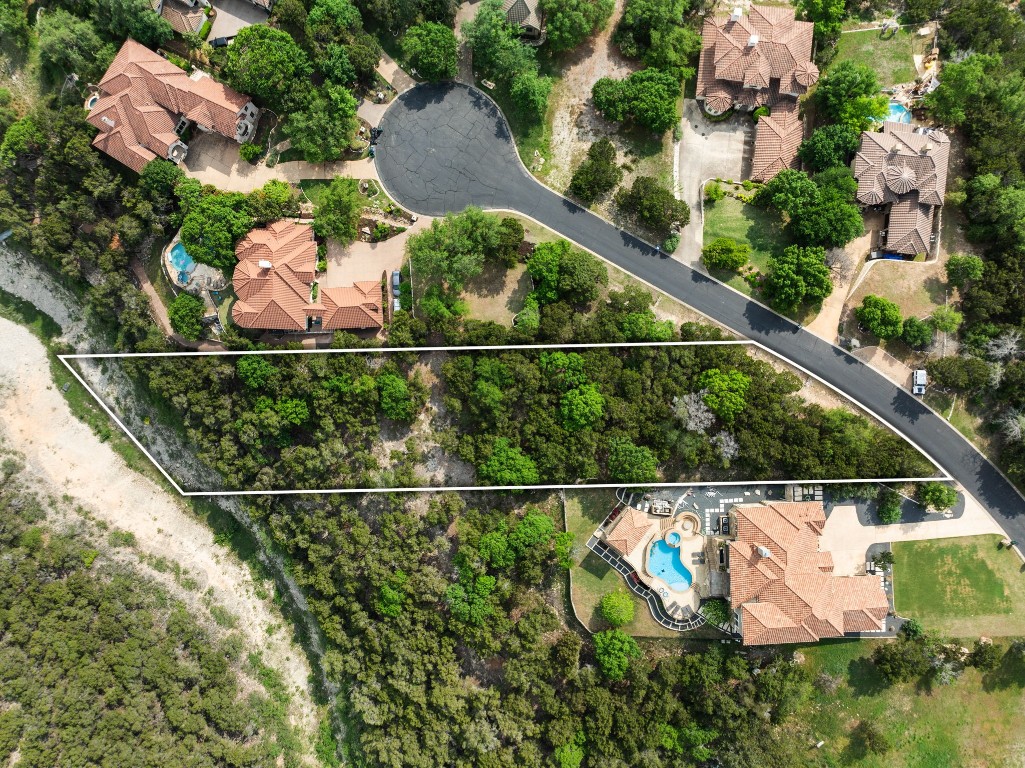 an aerial view of house with yard swimming pool and outdoor seating