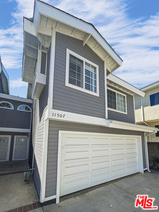 a front view of a house with parking space