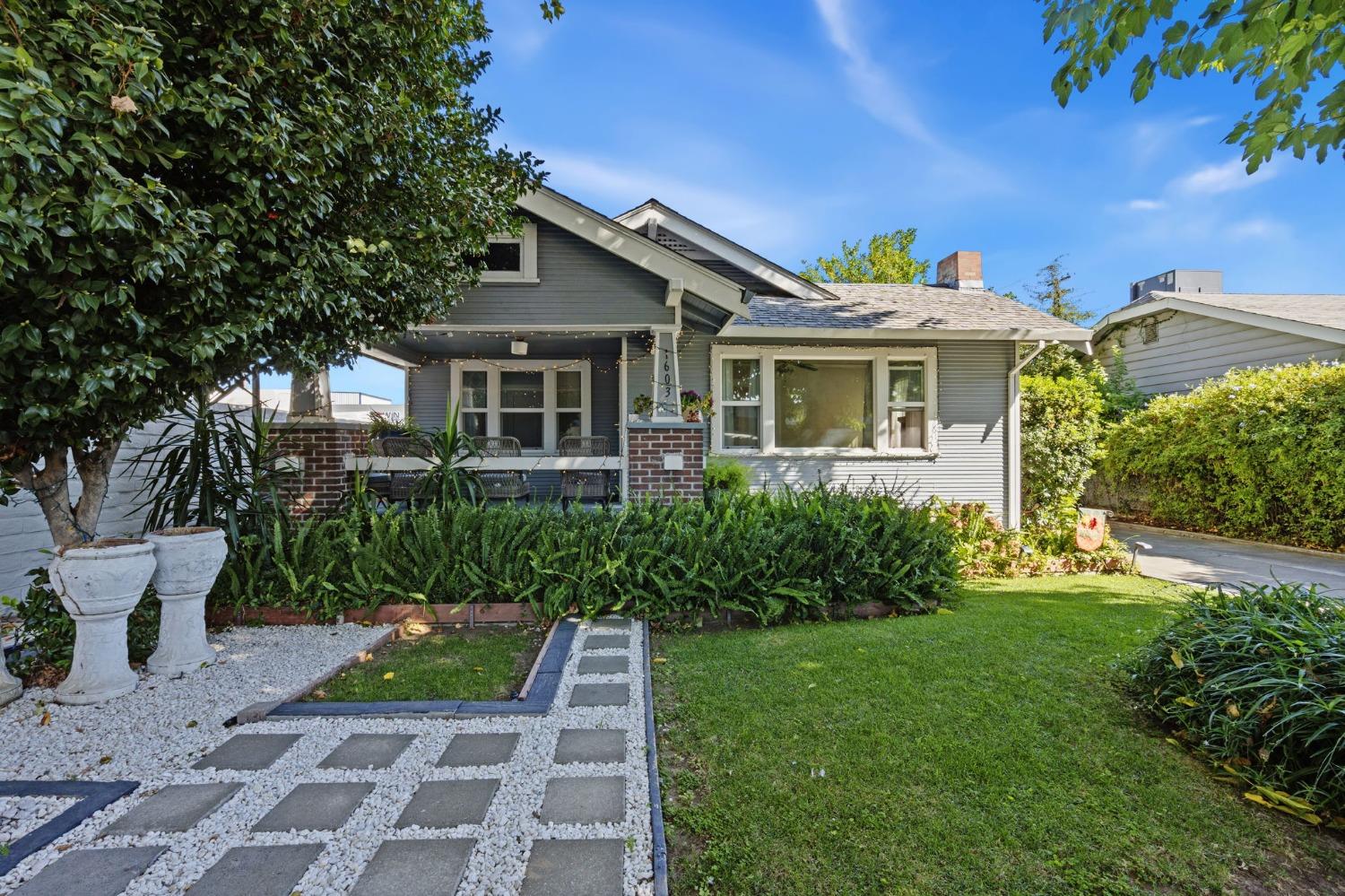 a front view of a house with garden