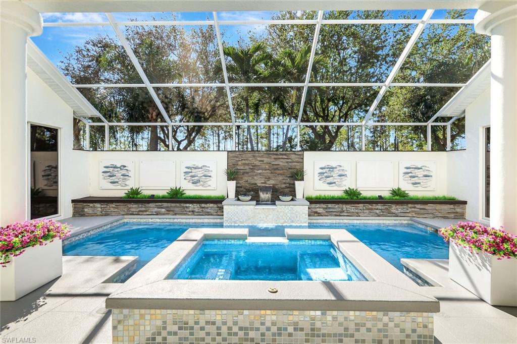 a view of swimming pool with sitting area