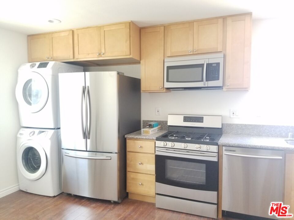 a kitchen with a stove and a microwave