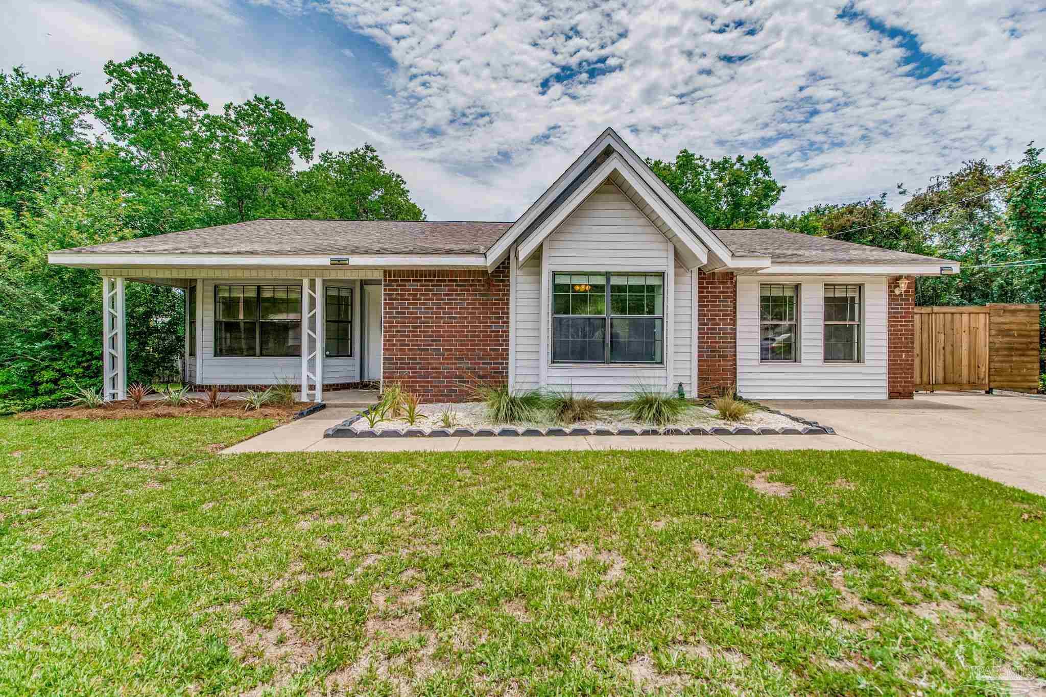 front view of a house with a yard