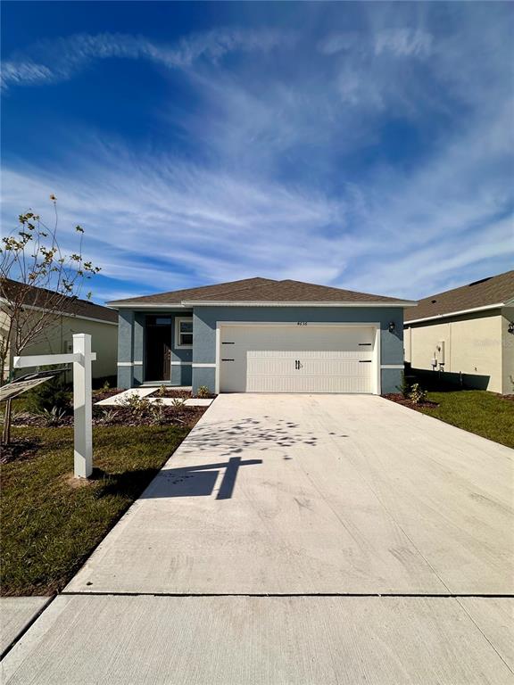 a front view of house with garage