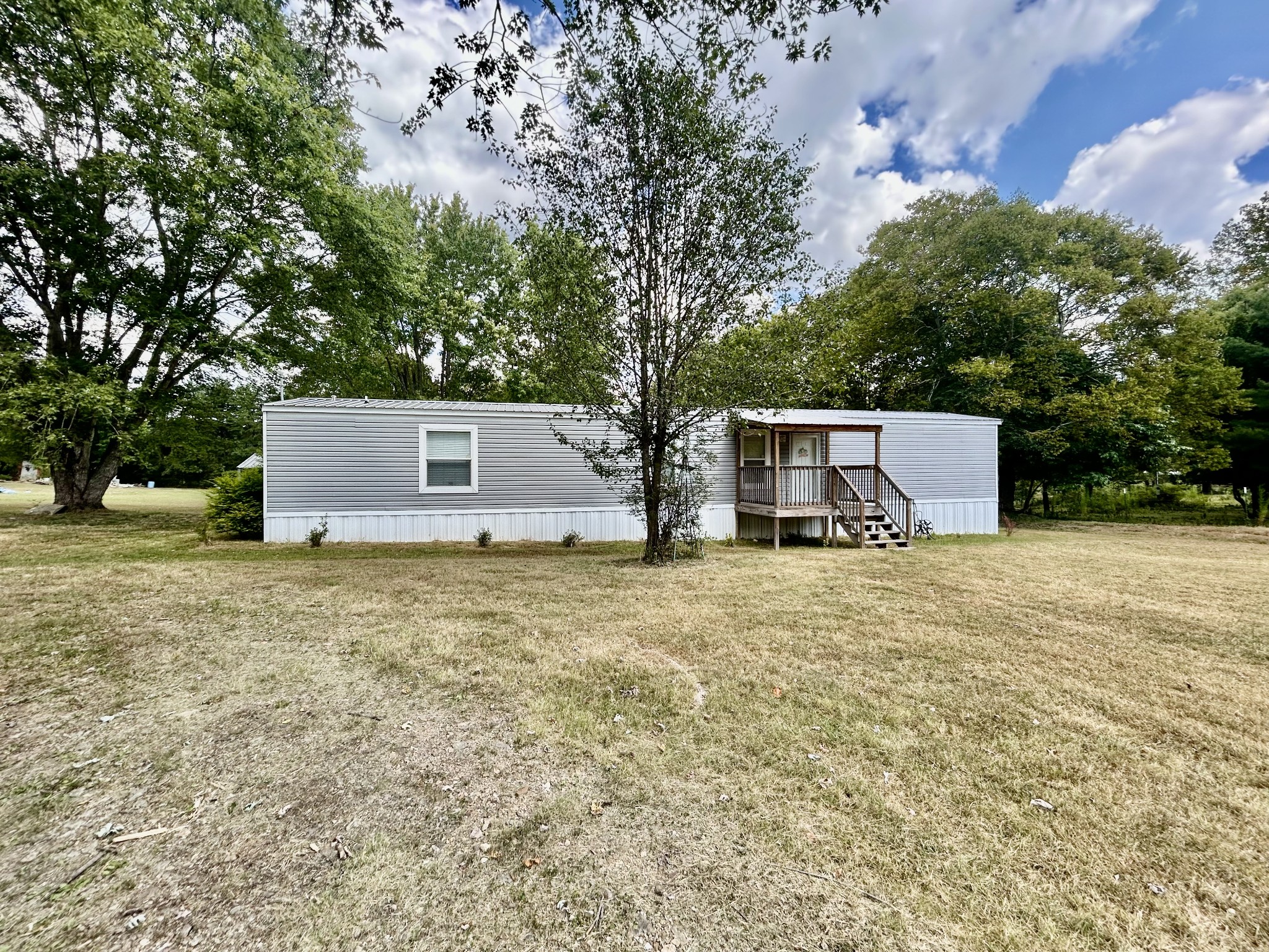 front view of a house with a yard