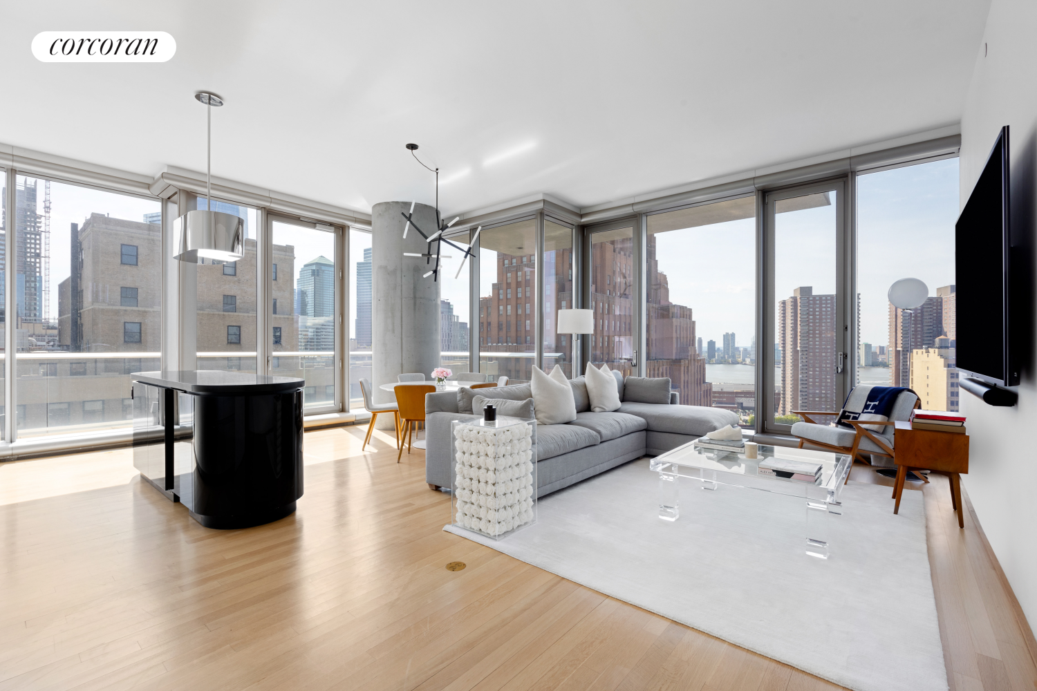 a living room with furniture and large windows