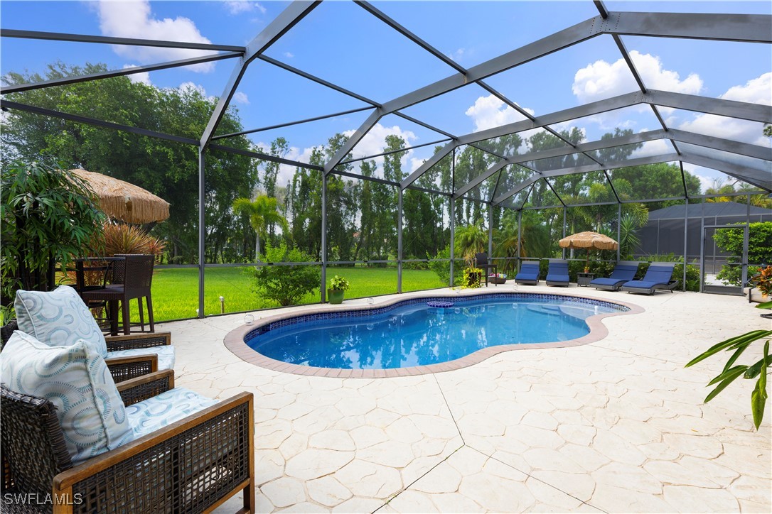 a view of a swimming pool with a patio