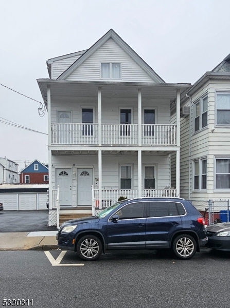 a car parked in front of a house