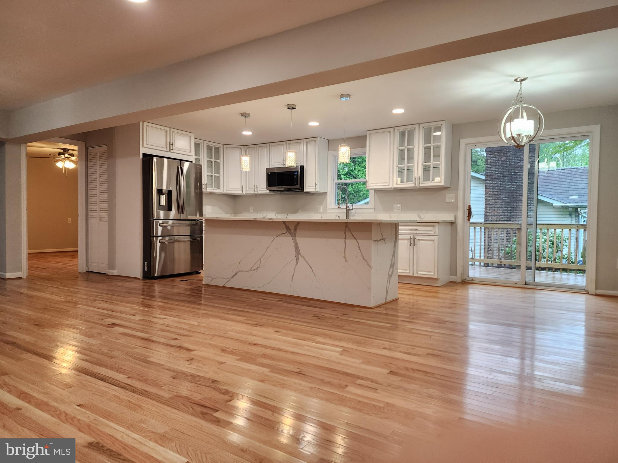 a view of kitchen with cabinets and stainless steel appliances