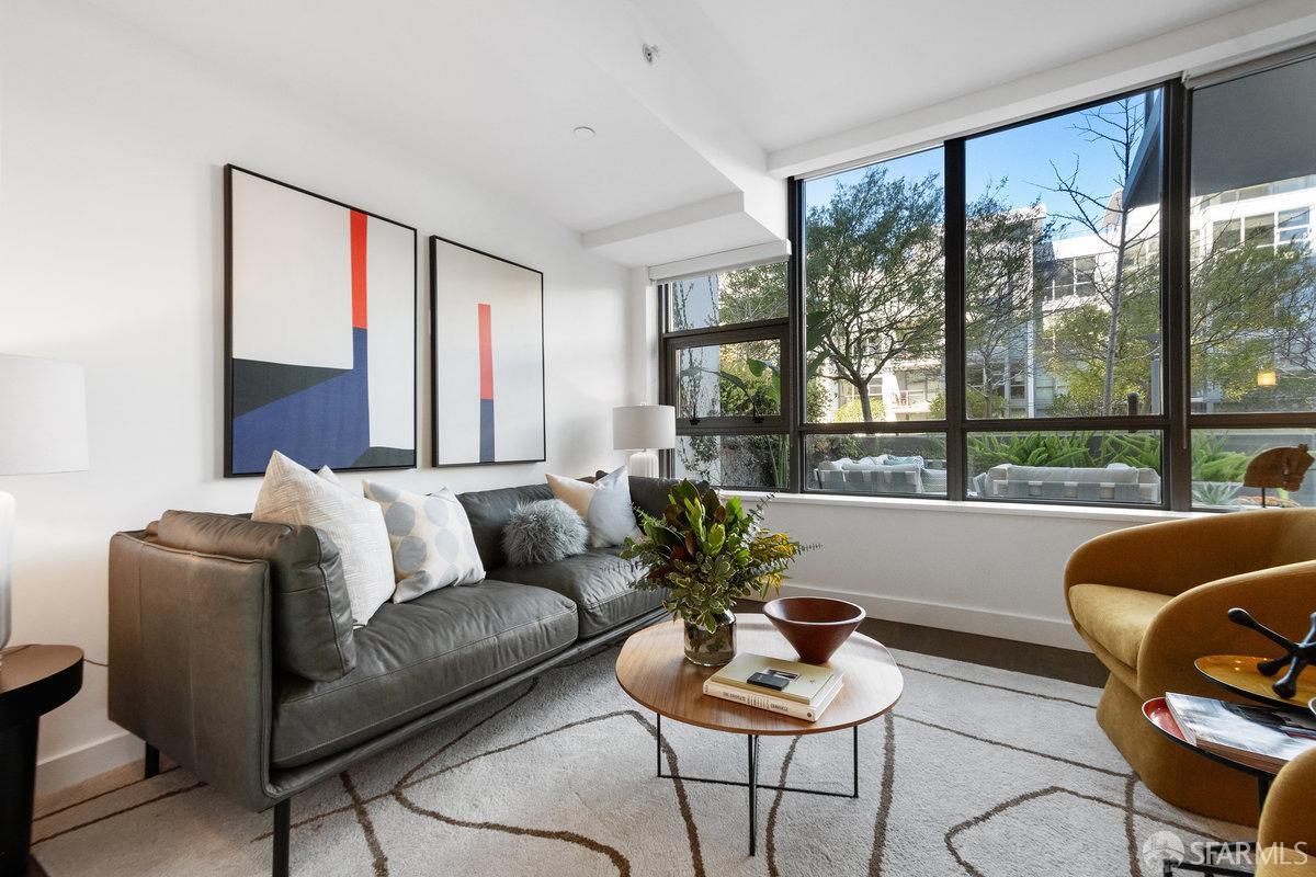 a living room with furniture and a large window