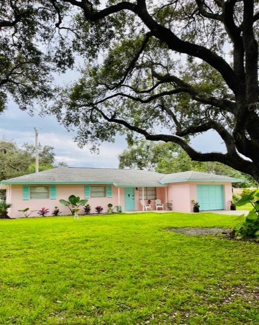 a front view of house with garden