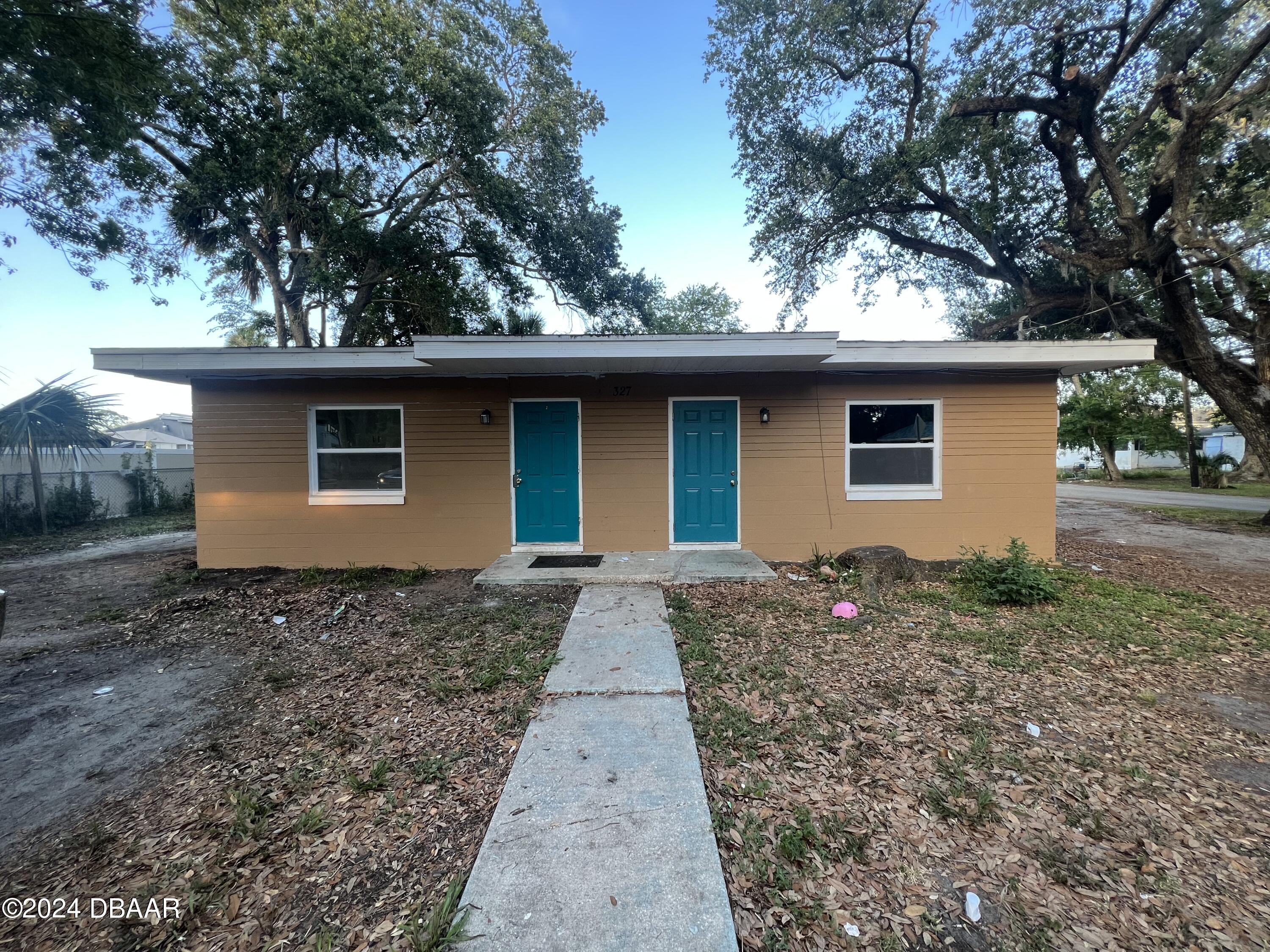 a house with trees in the background