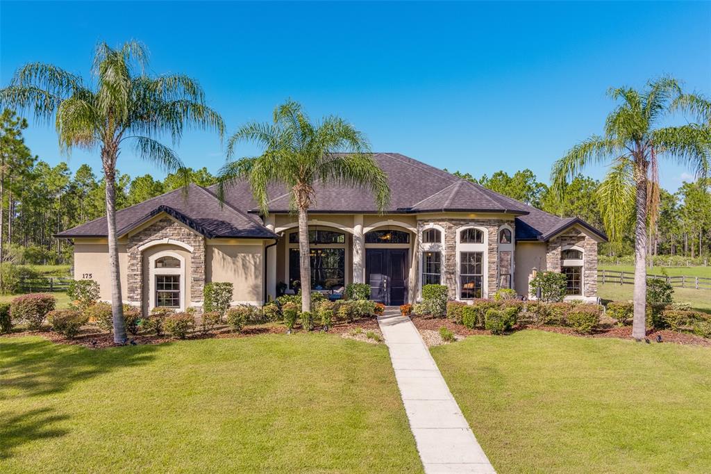 a front view of a house with swimming pool