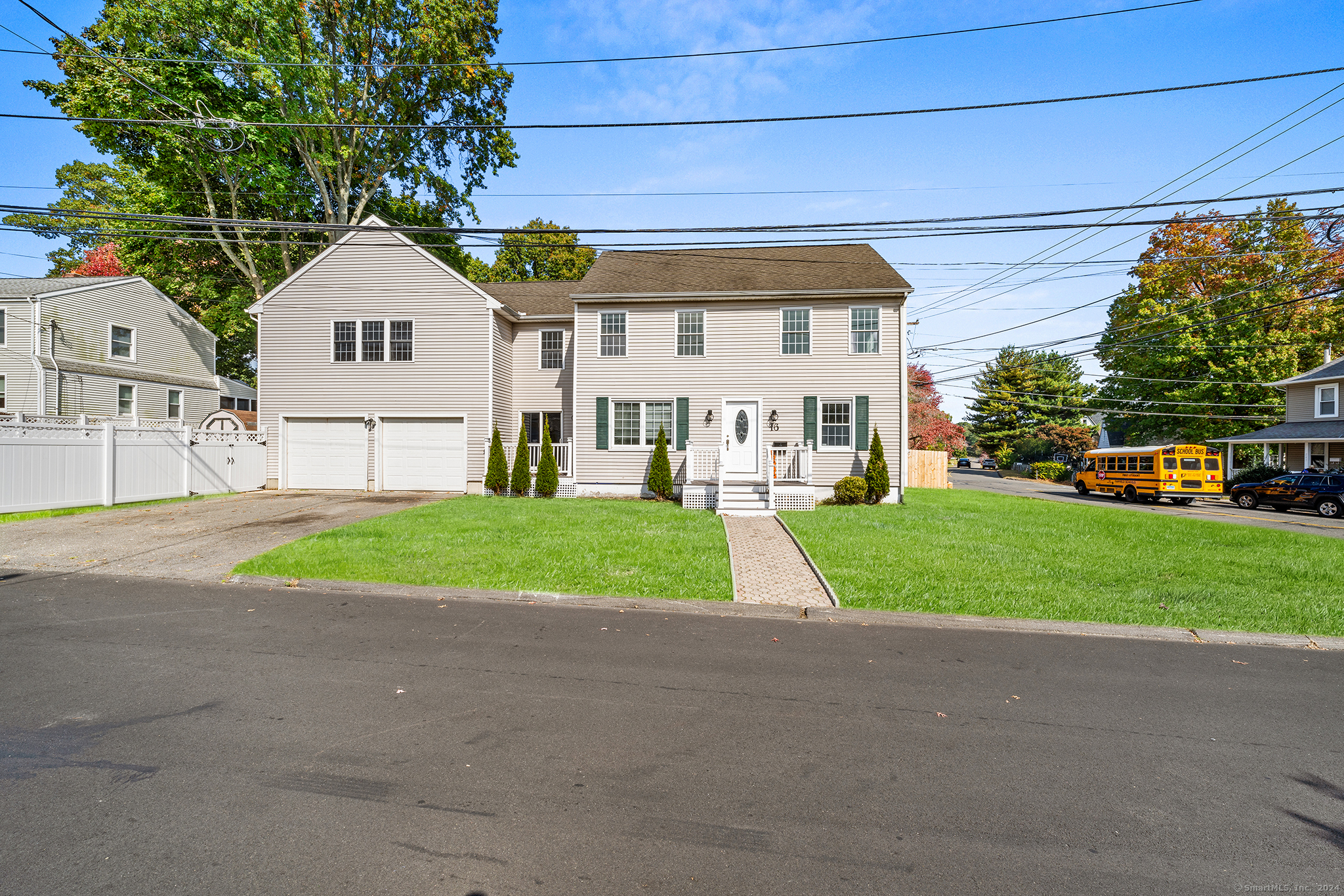 a view of house with outdoor space and parking