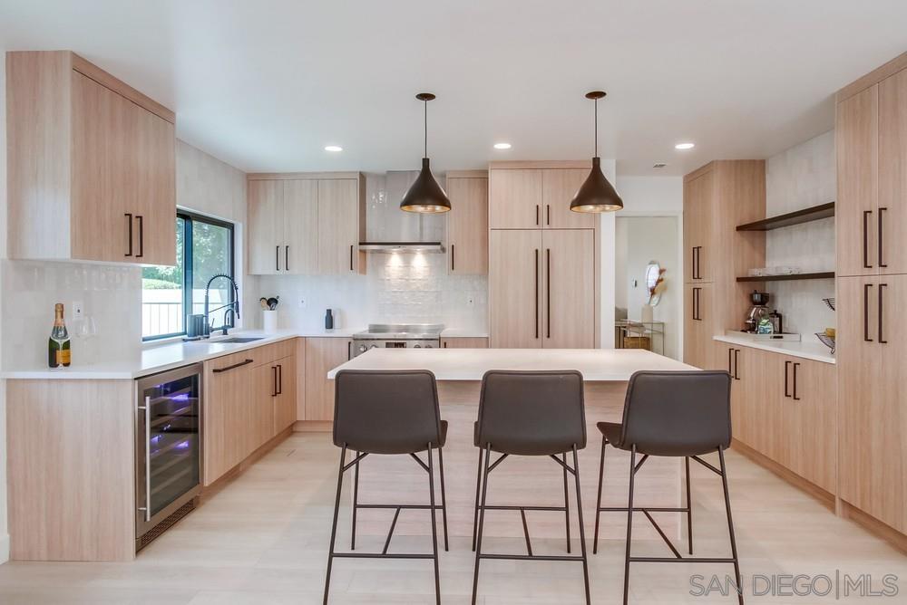 a kitchen with stainless steel appliances kitchen island a large island in the center