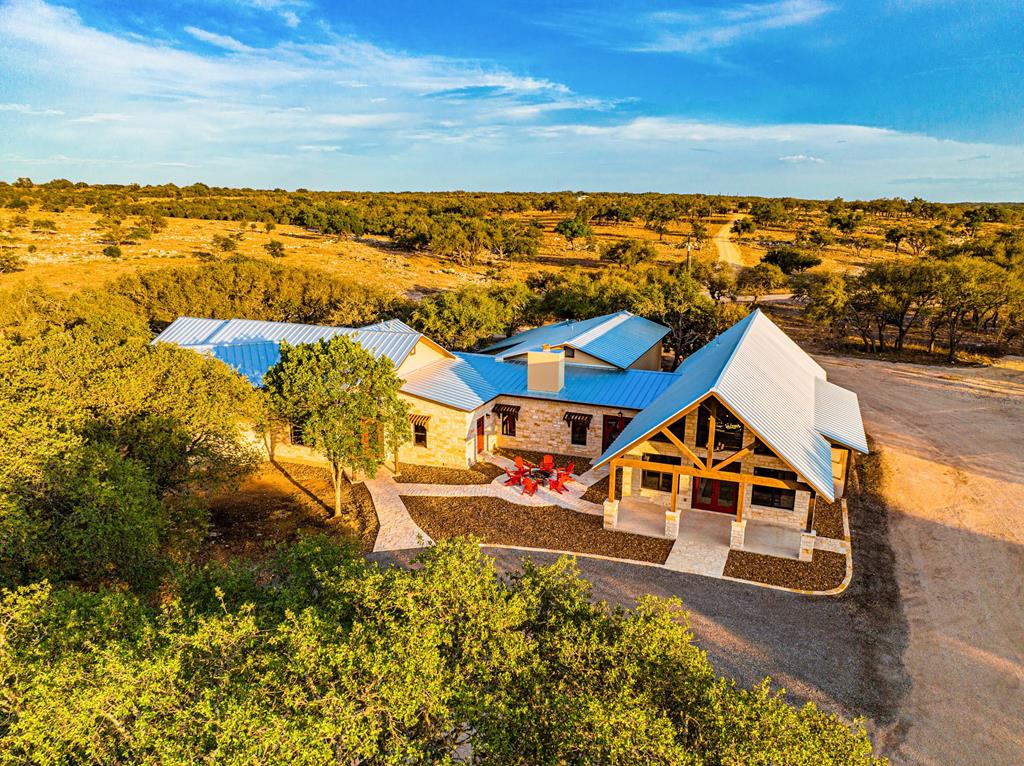 an aerial view of a house with a ocean view