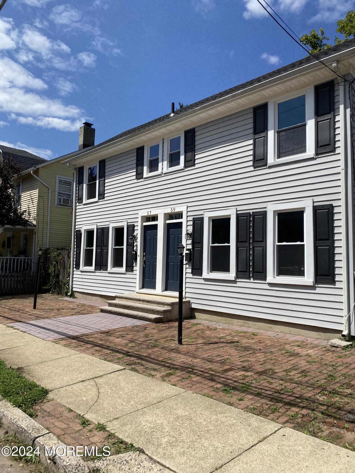 a front view of a house with a porch