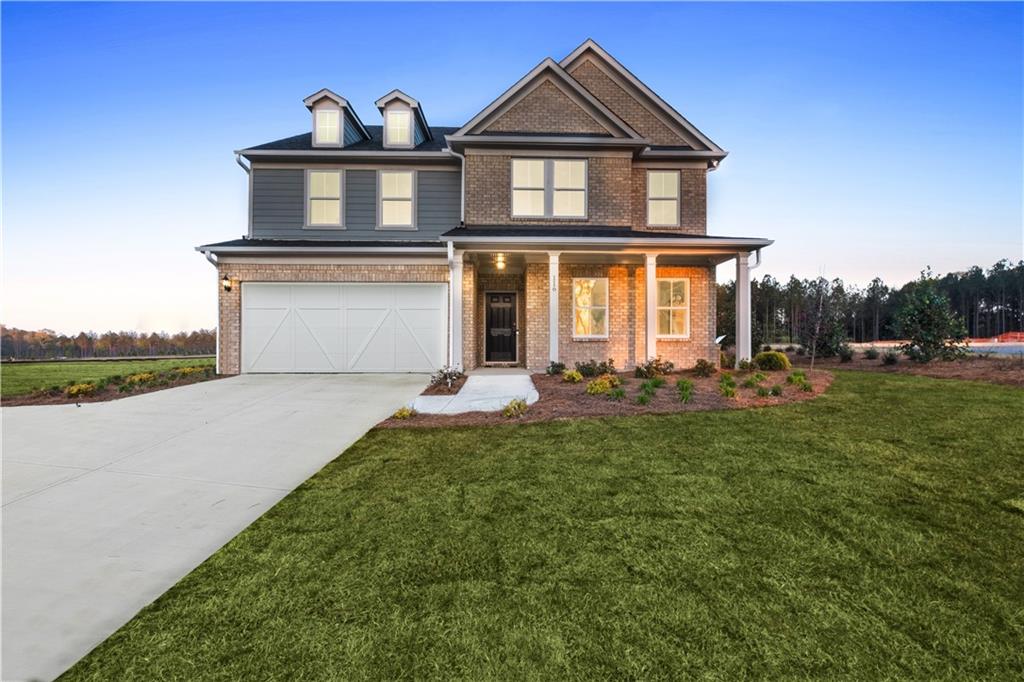 a front view of a house with a yard