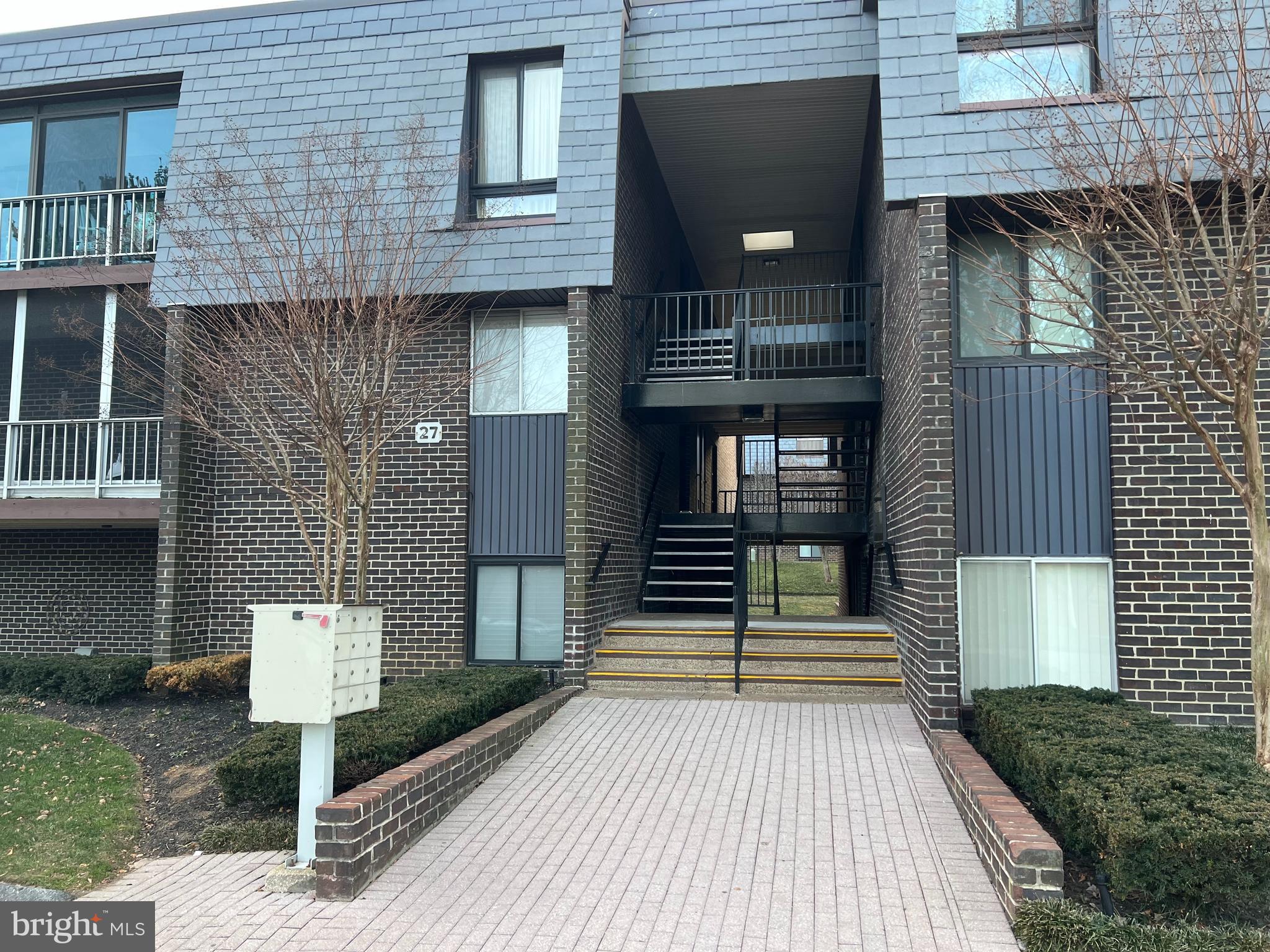 a front view of a house with stairs