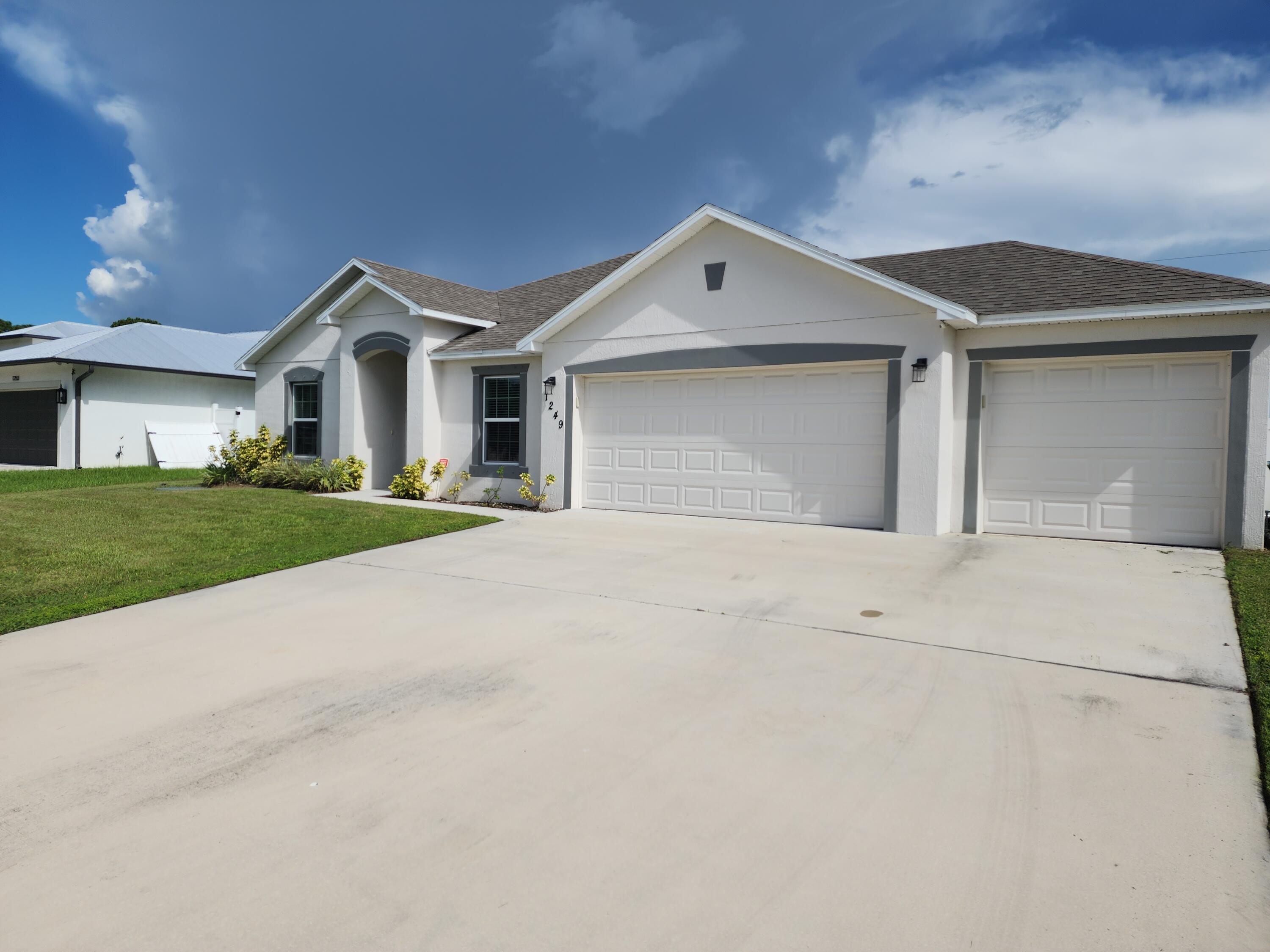 a view of garage and yard