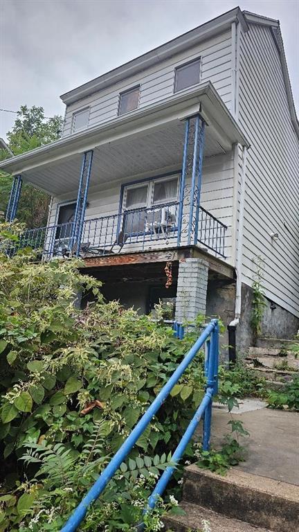 front view of a house with a small yard