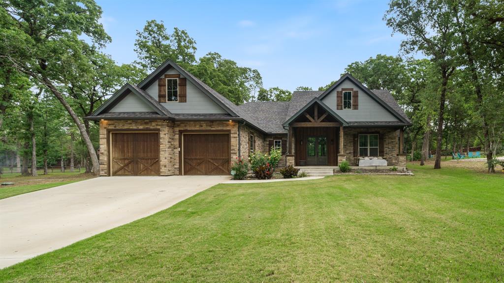 a front view of a house with swimming pool having outdoor seating