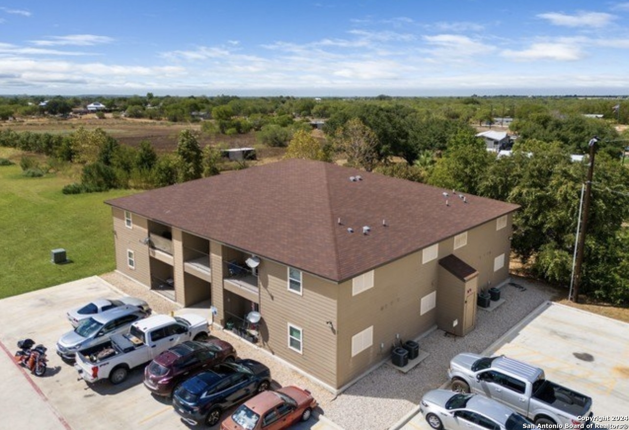 an aerial view of a house with a garden