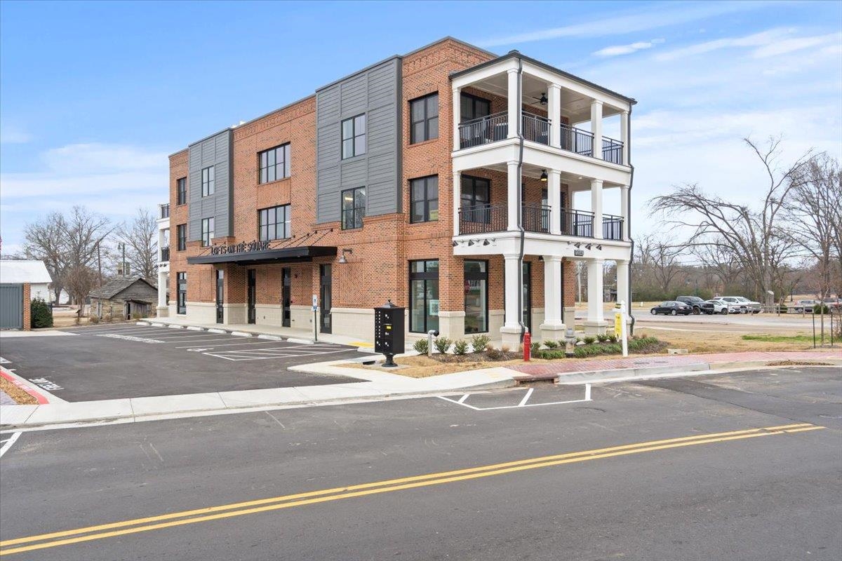 a view of a building with a street