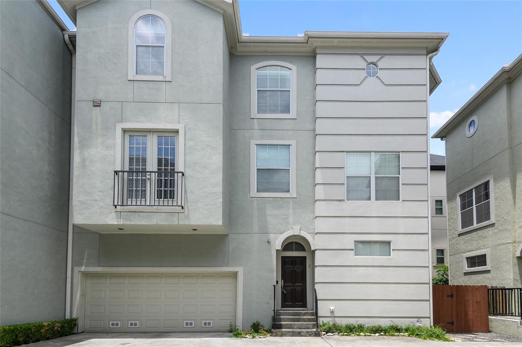 a front view of a house with a garage