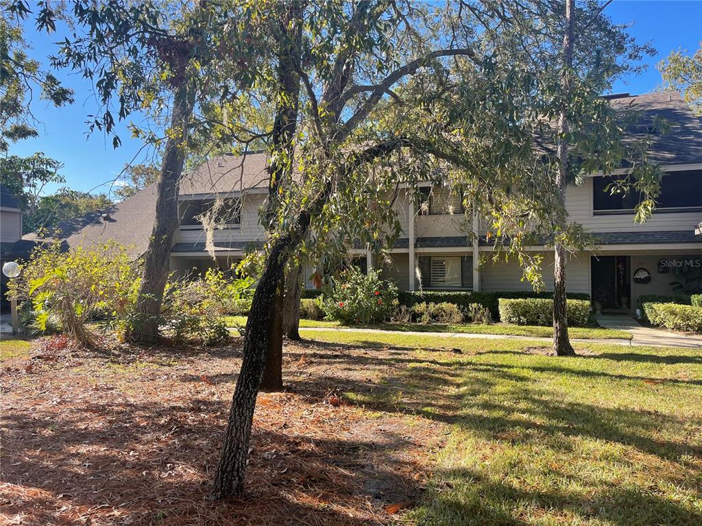 a view of a house with a yard