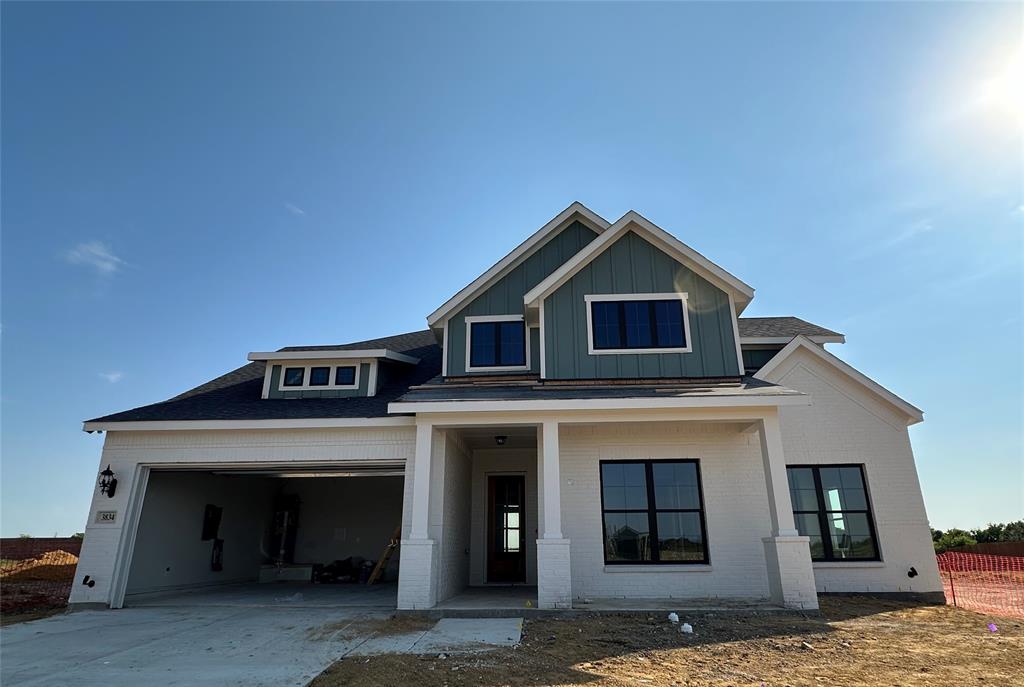 a front view of a house with garage