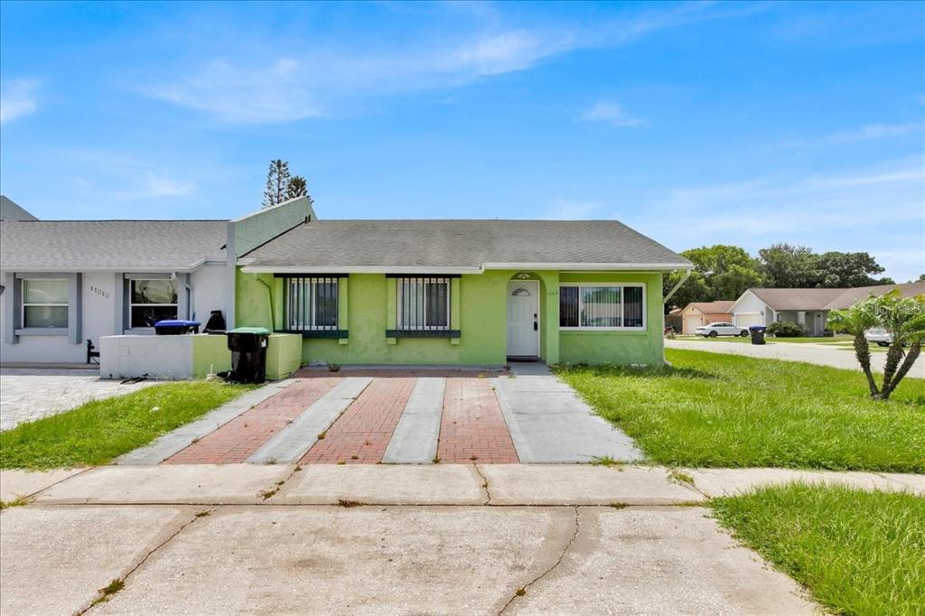 a front view of a house with a yard