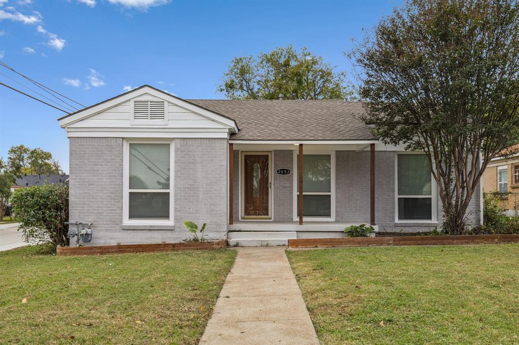 front view of a house with a yard