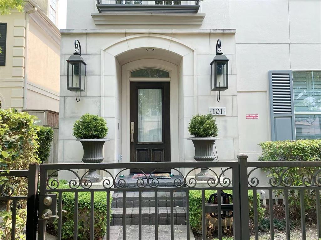 a front view of a house with plants