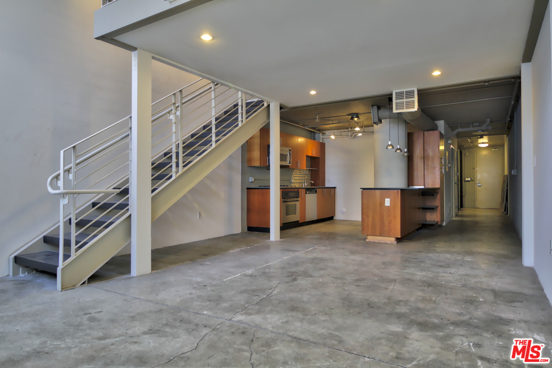 a view of a hallway with seating space