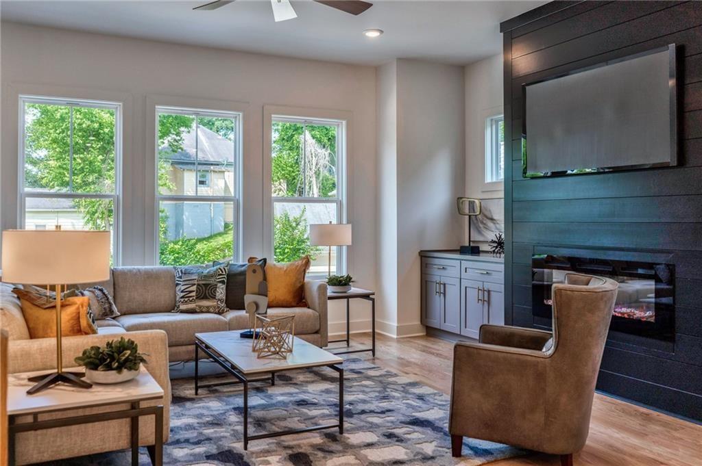 a living room with furniture and a flat screen tv