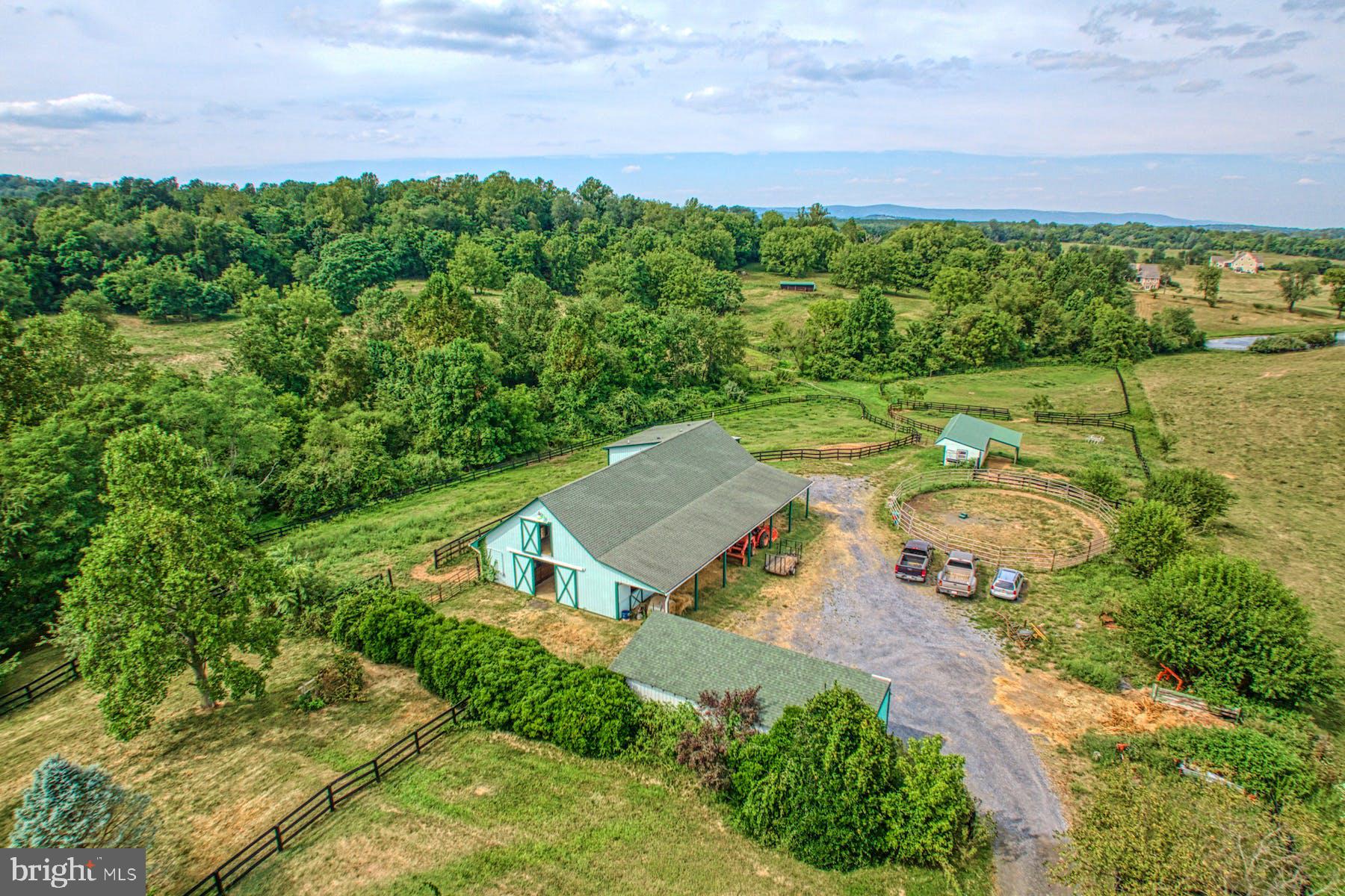 an aerial view of a house with garden space and outdoor space