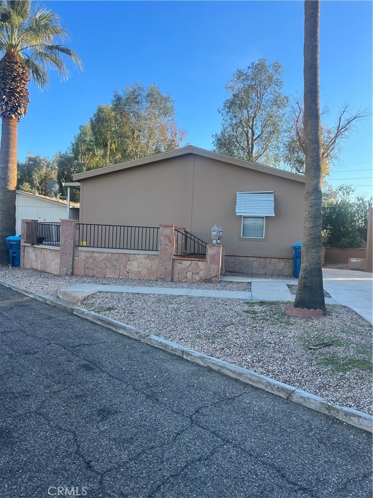 a front view of a house with a yard and a garage