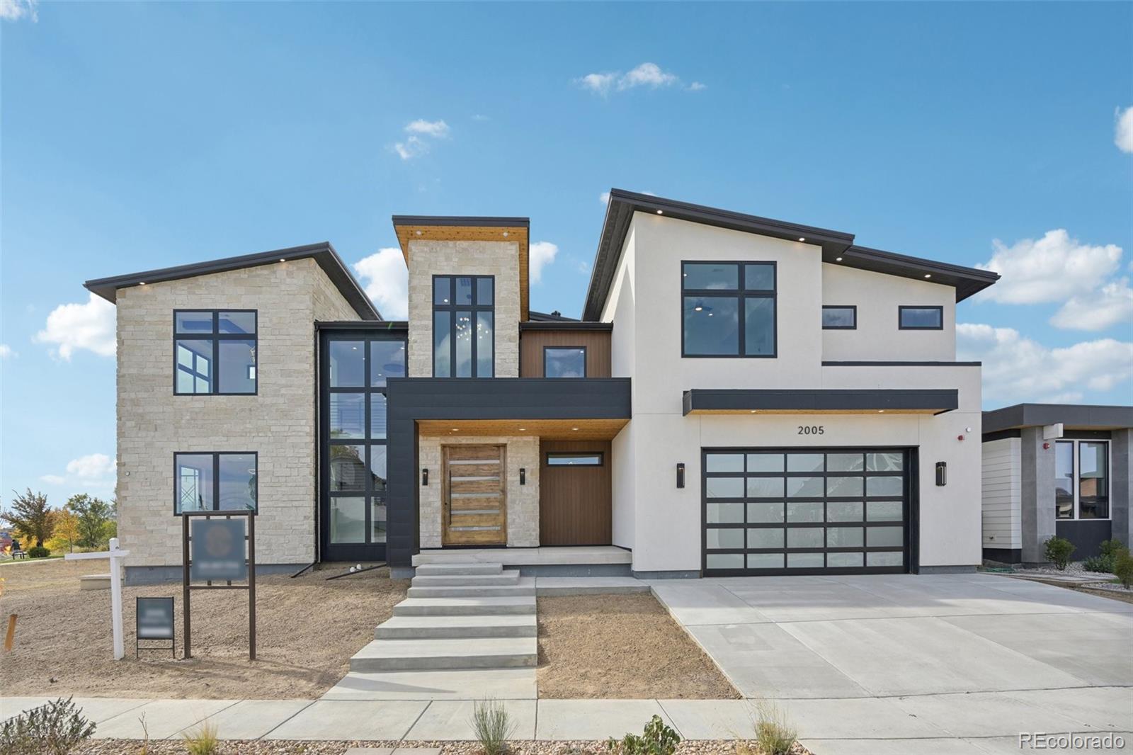 a front view of a house with a garage