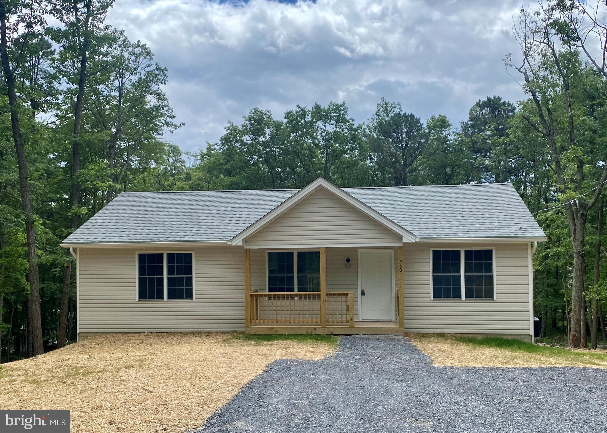 front view of a house and a yard