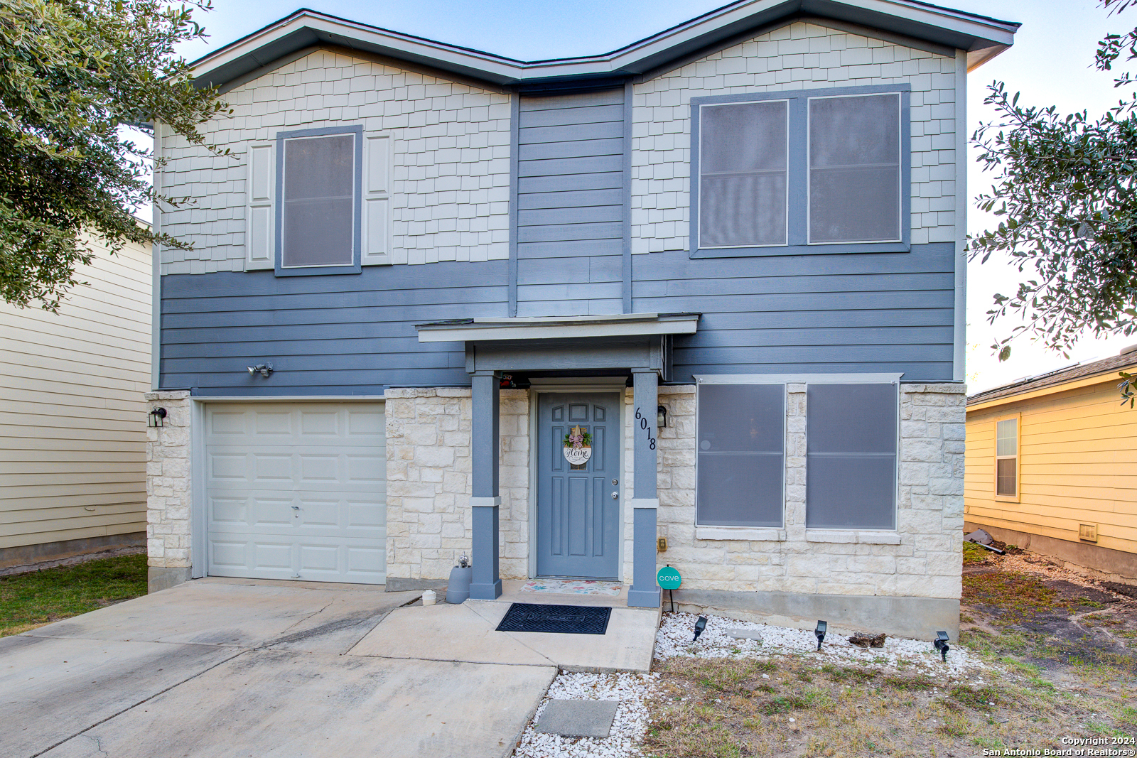 a front view of a house with a garage