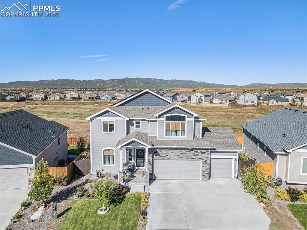 Front of home showcasing open space in back.