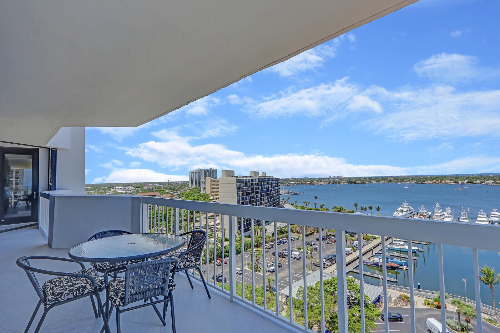 a view of a balcony with table and chairs